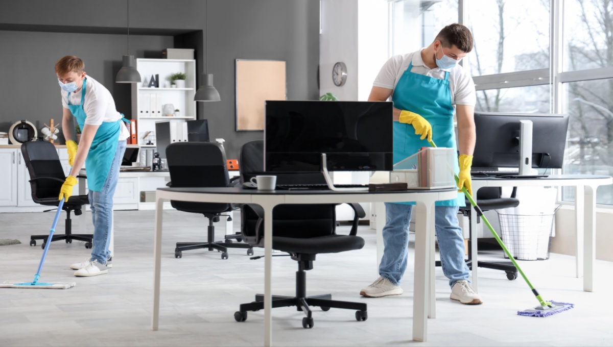 Reliable Office Cleaning Services professionals mopping office floors and sanitizing workspaces for a clean, healthy, and productive environment.