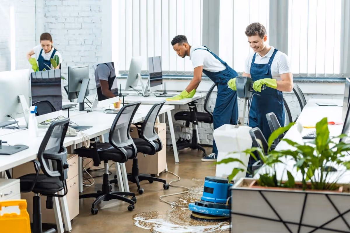 Expert Office Cleaning Services team deep cleaning workstations and polishing office floors to create a spotless, healthy, and productive workplace.