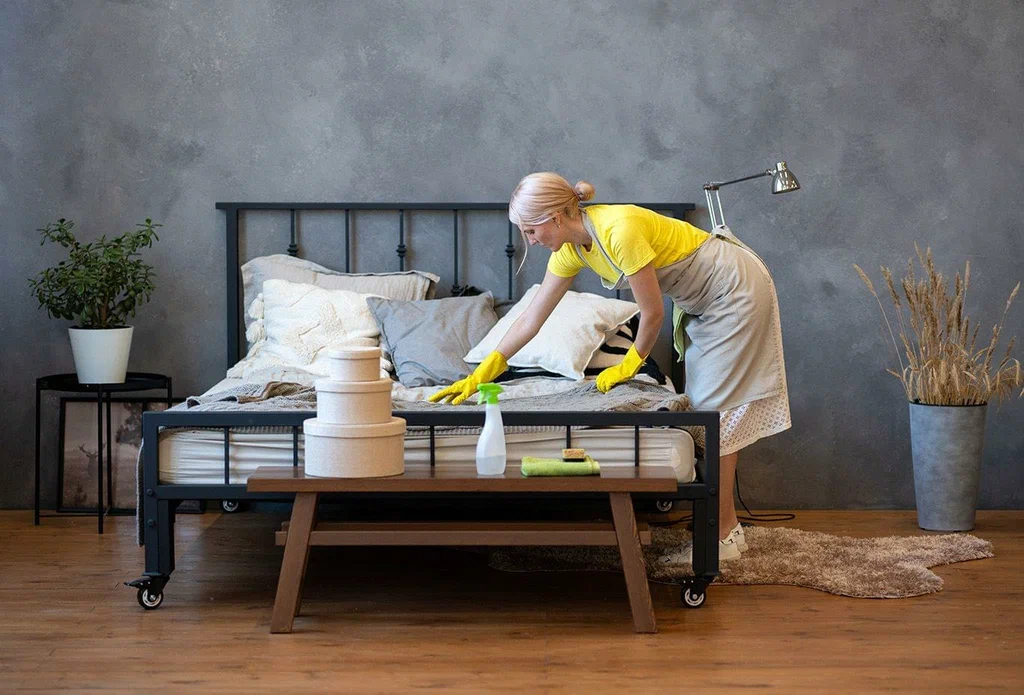 Airbnb Cleaning Experts professionally cleaning and refreshing a bedroom for a spotless, guest-ready stay.