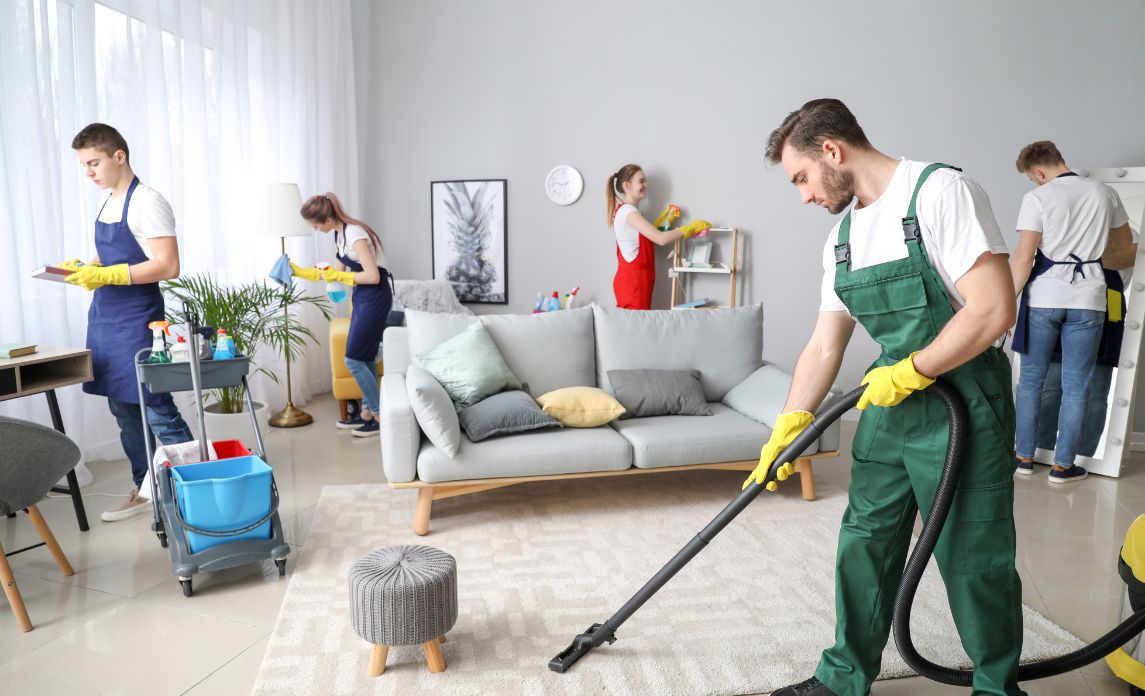 Home Cleaning professionals thoroughly vacuuming and cleaning a bright living room for a fresh, spotless, and welcoming home.
