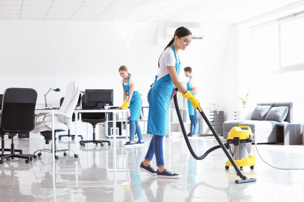 Commercial Cleaning professionals vacuuming office floors to create a fresh, clean, and welcoming workspace.