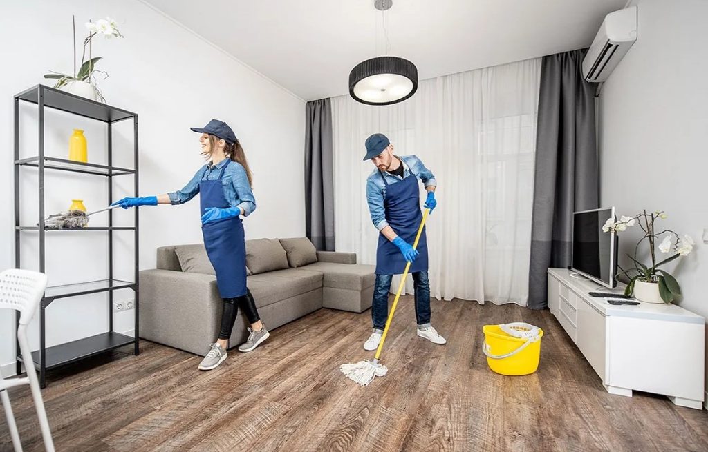 Professional Cleaning Service for Modern Homes Professional Cleaning Service team mopping and dusting a modern living room for a spotless, fresh, and welcoming home.