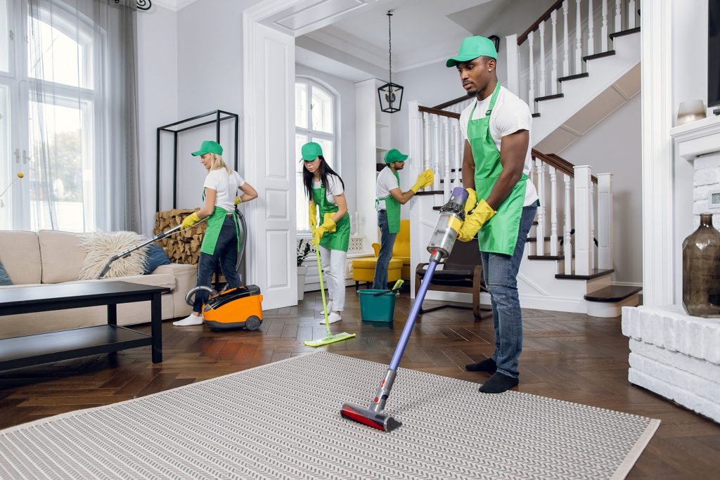 House Cleaning featuring a team vacuuming, mopping, and refreshing a bright, spacious home.